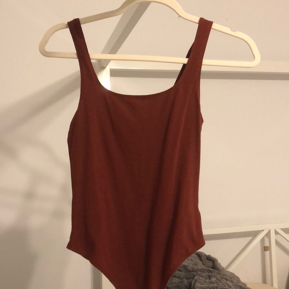 “Fired brick” colored bodysuit from garage